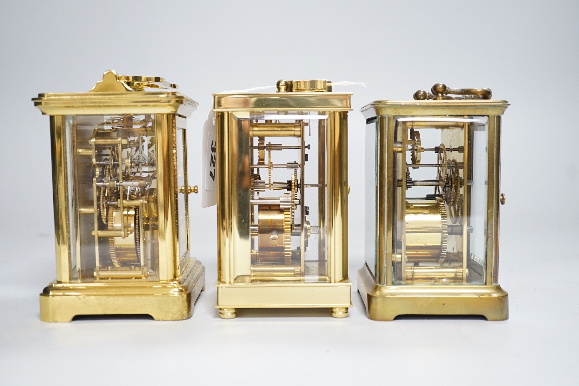 Two brass cased carriage timepieces and a brass cased carriage clock, tallest 11.5cms high